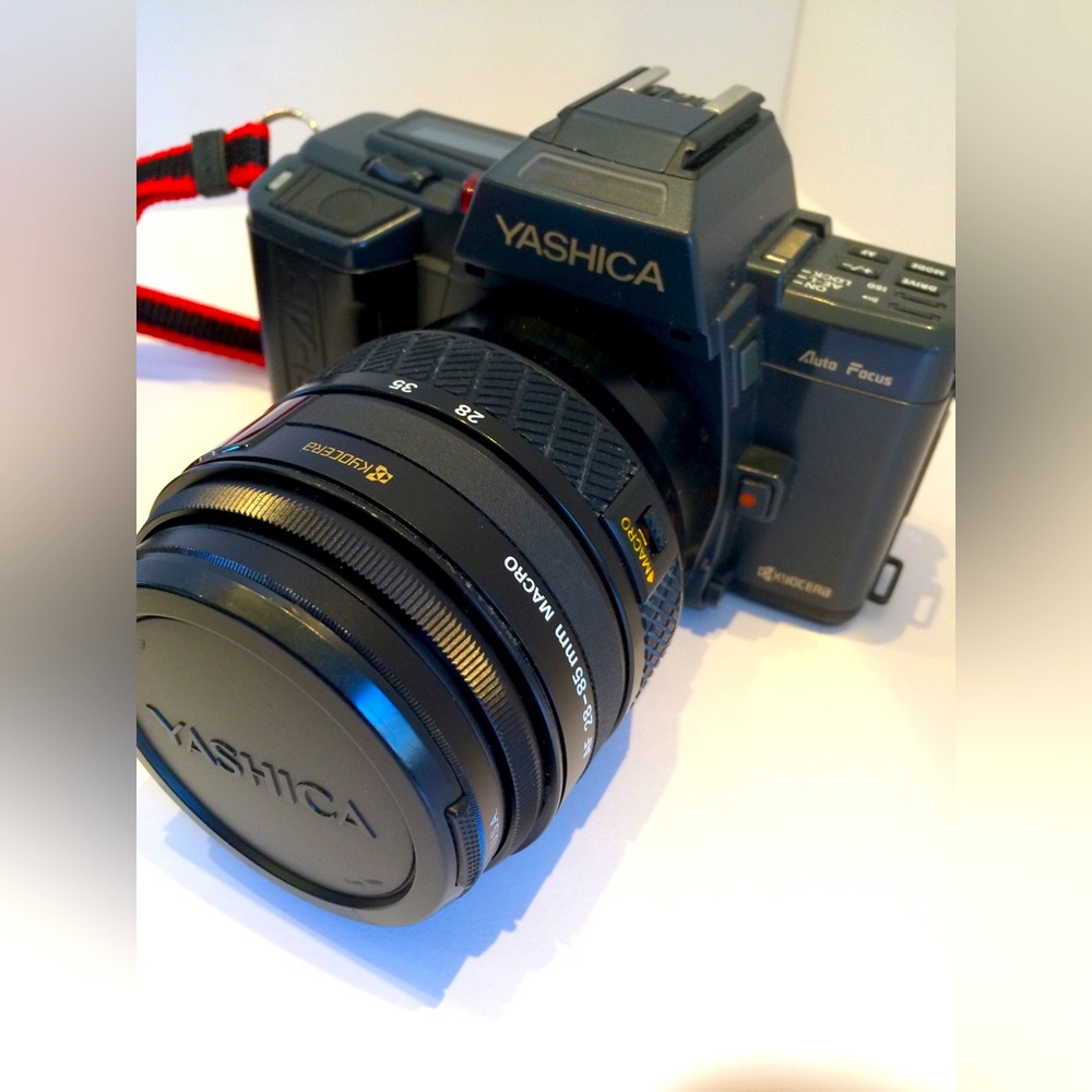 YASHICA Kyocera 230-AF 35mm Film SLR Camera, with Flash, Zoom Lenses, & Case